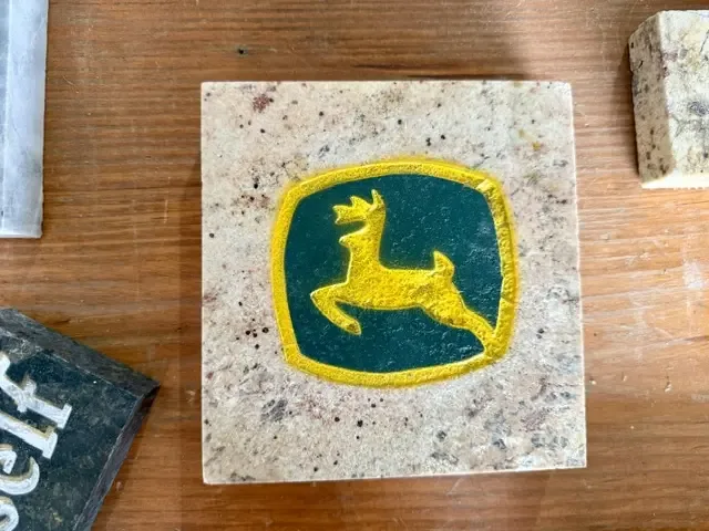Deer emblem light granite