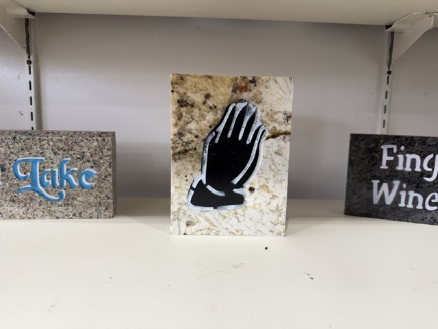 Praying Hands engraved in granite