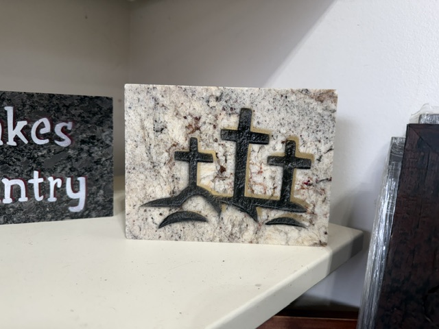 Three Crosses engraved in granite